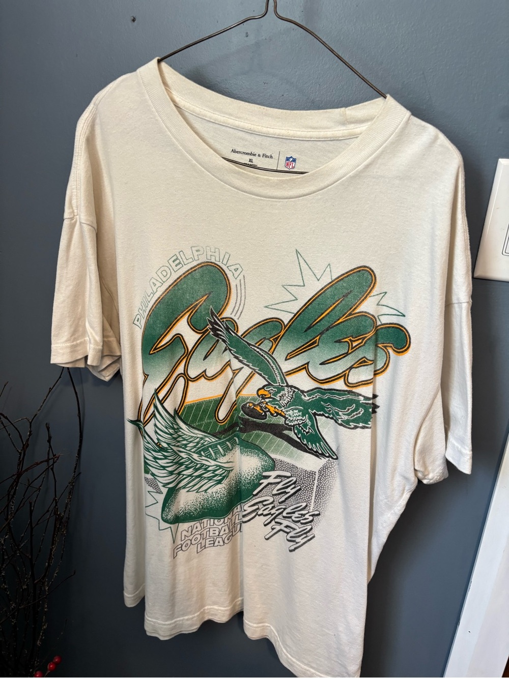 Abercrombie & Fitch Cream Tee with Green and Gold Eagles Graphic